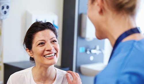 San Marcos patient smiling with their new dentures