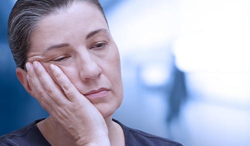 San Marcos patient with missing teeth looking sad