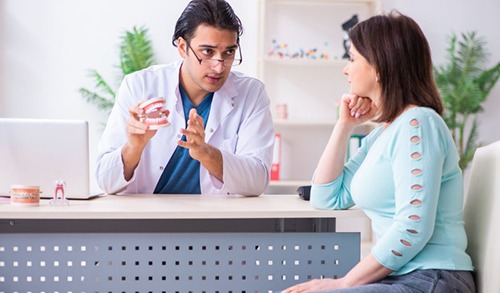 Woman listening to dentist during consultation