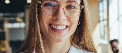 Close up of blonde woman with glasses smiling