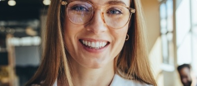 Close up of smiling woman with glasses