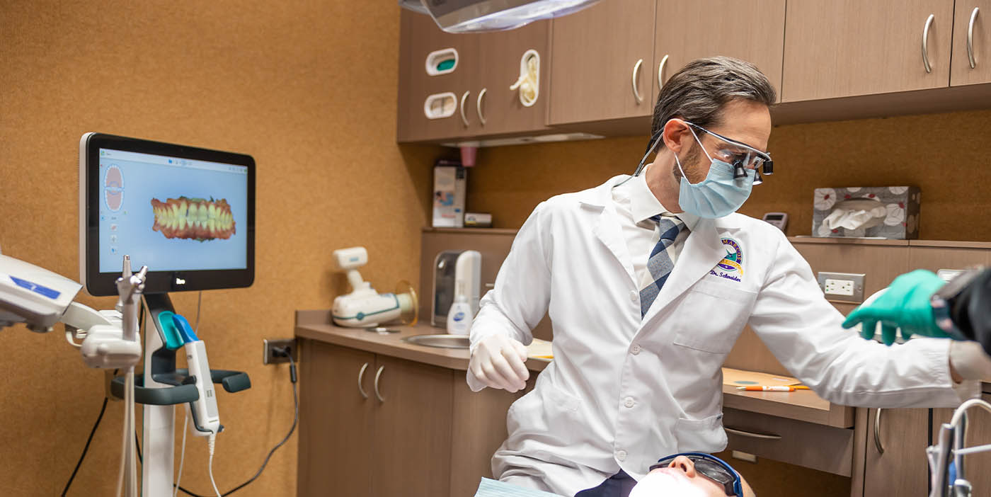 San Marcos dentist Doctor John Schneider treating a dental patient