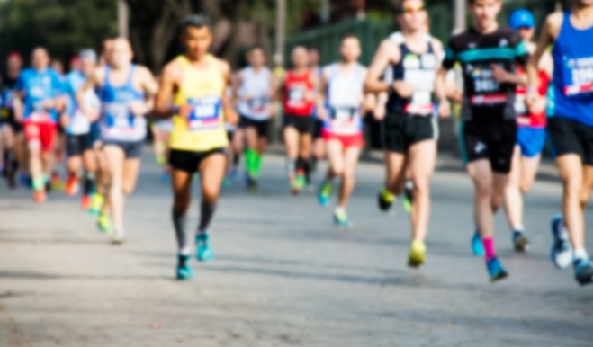 Dozens of people running a race