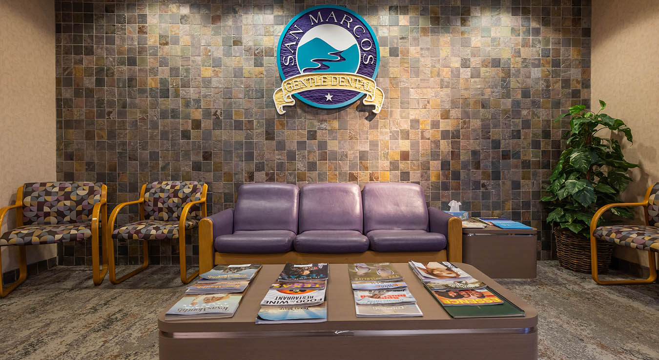 Couch and chairs in reception area of dental office