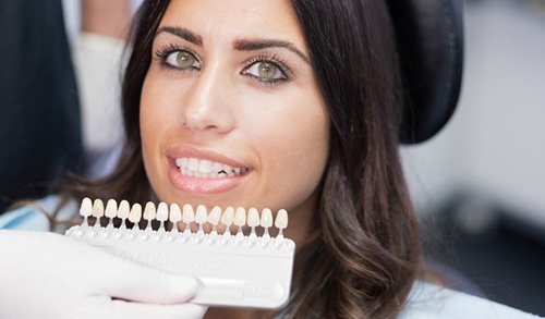 Woman in dental chair receiving veneers in San Marcos