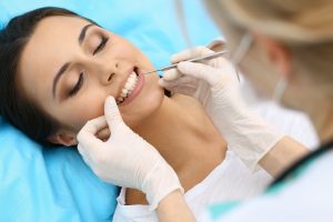 Relaxed woman getting a dental exam 