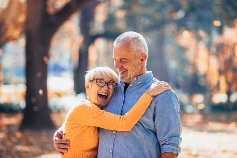 older couple hugging and smiling