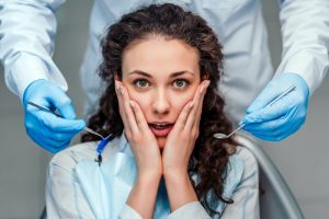 Concerned woman experiencing dental emergency