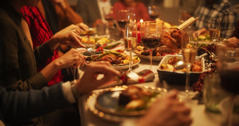 A family enjoying a holiday meal after diligent dental care