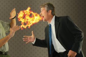 man blowing fire out of mouth