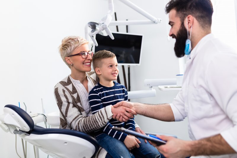 Mother and son seeing family dentist
