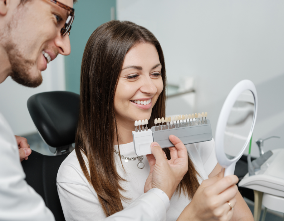 Dentist showing patient veneer shade options