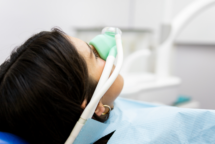 Woman with a nitrous oxide mask